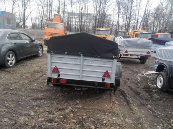 Прицеп для легкового автомобиля с V образным дышлом 2150х1300 с тентом и дугами в Москве фото 10